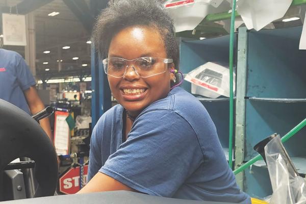 DeeDe Hardin describes how her ergo training makes her days less physically demanding as she works on the assembly line.