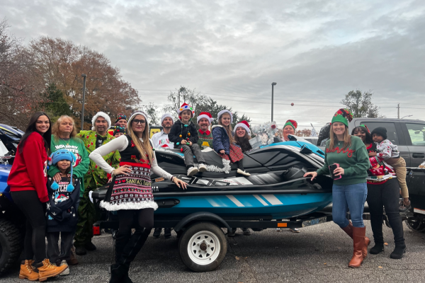 Yamaha families get ready to march in the recent Newnan Parade, alongside their WaveRunner, golf car, side-by-side, and other vehicles on display on their Yamaha float.