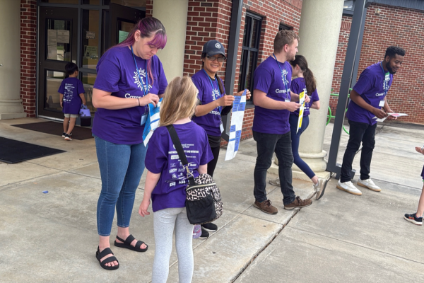 Yamaha team member Sydney Overton, a Ruth Hill alum, helps welcome campers during a fun-filled week of STEM learning at Camp Invention.